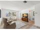 Light-filled living room with comfortable seating, wood floors, and a serene atmosphere at 204 Mindy Dr, Largo, FL 33771