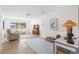 Bright living space features hardwood flooring, neutral decor, work space and comfortable seating at 204 Mindy Dr, Largo, FL 33771