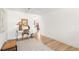 Bright living space with hardwood flooring, and a comfortable work space with a view into the kitchen at 204 Mindy Dr, Largo, FL 33771