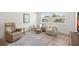 Sunlit living room featuring comfortable seating, modern decor, and a cozy ambiance at 204 Mindy Dr, Largo, FL 33771