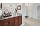Attractive bar area with wood cabinets, countertop, and easy access to living area at 2306 Emerald Lake Dr, Sun City Center, FL 33573
