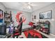 Bedroom featuring a gaming setup, stylish decor, and a comfortable sleeping area at 2306 Emerald Lake Dr, Sun City Center, FL 33573