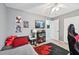 Bedroom featuring a gaming setup, stylish decor, and a comfortable sleeping area at 2306 Emerald Lake Dr, Sun City Center, FL 33573