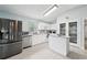 Bright, modern kitchen with a central island and stainless steel appliances at 2306 Emerald Lake Dr, Sun City Center, FL 33573
