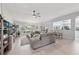 Bright living room boasts of light floors, fan and an open layout perfect for entertaining at 2306 Emerald Lake Dr, Sun City Center, FL 33573