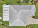A top-down aerial view of a well-maintained roof and landscaped yard at 2306 Emerald Lake Dr, Sun City Center, FL 33573