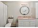 Bathroom with modern vanity, round mirror, and shower at 2650 60Th N Ave, St Petersburg, FL 33714