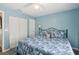 Bedroom featuring blue walls, closet, ceiling fan, and carpet flooring at 2650 60Th N Ave, St Petersburg, FL 33714
