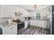 Well-lit kitchen featuring stainless steel appliances, granite countertops, and tile backsplash at 2650 60Th N Ave, St Petersburg, FL 33714