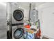 Laundry room featuring a modern washer/dryer unit, storage shelving, and essential utility equipment at 2650 60Th N Ave, St Petersburg, FL 33714