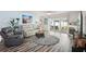 Bright living room featuring a gray leather sofa, fireplace, and sliding glass doors at 2650 60Th N Ave, St Petersburg, FL 33714