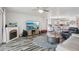 Open-concept living area with fireplace, dining table and chairs, and modern furnishings at 2650 60Th N Ave, St Petersburg, FL 33714