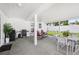Covered patio with a grill, outdoor seating, and a view of the well-maintained lawn at 2650 60Th N Ave, St Petersburg, FL 33714