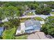 Aerial view of the house and fenced backyard, complete with patio and plenty of space for outdoor enjoyment at 2692 Cedarbrooke Dr, Palm Harbor, FL 34684