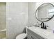 Tastefully updated bathroom showcasing a modern vanity and tiled walls at 2692 Cedarbrooke Dr, Palm Harbor, FL 34684