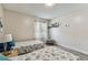 Bedroom showcasing two twin beds, a window with sheer curtains, and neutral decor at 2692 Cedarbrooke Dr, Palm Harbor, FL 34684