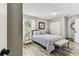 Inviting bedroom featuring a comfortable bed and neutral decor for a relaxing ambiance at 2692 Cedarbrooke Dr, Palm Harbor, FL 34684