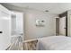 Spacious bedroom providing a glimpse into the attached bathroom with tiled shower at 2692 Cedarbrooke Dr, Palm Harbor, FL 34684