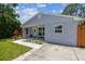 Beautiful home featuring a cozy front porch, beautiful landscaping, and lots of curb appeal at 2692 Cedarbrooke Dr, Palm Harbor, FL 34684