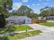 Charming single-story home boasting a well-manicured lawn, inviting entryway, and extended driveway at 2692 Cedarbrooke Dr, Palm Harbor, FL 34684