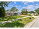 Charming single-story home boasts a well-manicured lawn, mature trees, and tasteful landscaping at 2692 Cedarbrooke Dr, Palm Harbor, FL 34684