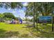 Well-maintained community playground with vibrant play structures, a picnic table, and a visible community sign at 2692 Cedarbrooke Dr, Palm Harbor, FL 34684