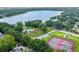 Active community features a pool, playground, and tennis courts near a lake for residents to enjoy at 2692 Cedarbrooke Dr, Palm Harbor, FL 34684