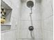 Modern tiled shower featuring dual shower heads and a niche at 2692 Cedarbrooke Dr, Palm Harbor, FL 34684