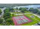 Community amenities offer tennis courts near a lake and playground for active lifestyles at 2692 Cedarbrooke Dr, Palm Harbor, FL 34684