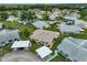 Aerial shot showcases the property in a well-manicured community with convenient carport parking at 304 Fowling Ct # A, Sun City Center, FL 33573