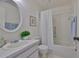 Bright white bathroom with shower/tub combination and classic vanity at 304 Fowling Ct # A, Sun City Center, FL 33573