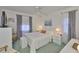 Bright bedroom featuring a comfy bed, soft lighting, and a tranquil ambiance perfect for rest and relaxation at 304 Fowling Ct # A, Sun City Center, FL 33573