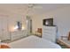 Comfortable bedroom featuring a clean, classic look with TV, dresser, and ensuite bathroom access at 304 Fowling Ct # A, Sun City Center, FL 33573