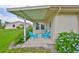 Covered patio with outdoor seating, offering a pleasant outdoor retreat at 304 Fowling Ct # A, Sun City Center, FL 33573