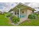 Charming outdoor patio with blue Adirondack chairs, perfect for relaxing and enjoying the scenery at 304 Fowling Ct # A, Sun City Center, FL 33573
