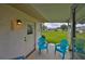 Cozy outdoor patio featuring comfortable seating and a serene view of the landscaped backyard at 304 Fowling Ct # A, Sun City Center, FL 33573