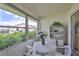 Enclosed patio with seating and outdoor view at 304 Fowling Ct # A, Sun City Center, FL 33573