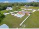 Aerial shot showcasing a pool and the backyard of this charming single-Gathering home at 30703 San An Rd, San Antonio, FL 33576