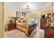 Comfortable bedroom with neutral colors, traditional furniture, and natural light at 30703 San An Rd, San Antonio, FL 33576