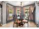 Cozy breakfast nook with large windows, elegant furnishings, and soft natural lighting at 30703 San An Rd, San Antonio, FL 33576