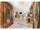 Elegant entryway featuring tile flooring, ornate decor, and a view into the living space at 30703 San An Rd, San Antonio, FL 33576