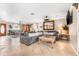 Comfortable living room featuring tile flooring, a plush sofa, and stylish furnishings at 30703 San An Rd, San Antonio, FL 33576