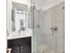 Sleek bathroom with a glass-enclosed shower, modern fixtures, and a vanity with ample counter space at 3100 W Paul Ave # 14, Tampa, FL 33611