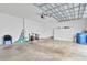 Spacious garage featuring an automatic door opener, and ample storage with white cabinets at 3100 W Paul Ave # 14, Tampa, FL 33611