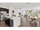 Spacious, open-concept living space that connects the kitchen and the living room, featuring modern decor at 3100 W Paul Ave # 14, Tampa, FL 33611