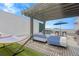 Inviting rooftop deck with lounge seating, a pergola, a hammock, and a hot tub for ultimate relaxation at 3100 W Paul Ave # 14, Tampa, FL 33611