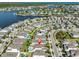 Drone perspective of community, highlighting homes near a large lake and neighborhood design at 314 Blackrock Ln, Apollo Beach, FL 33572