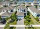 Aerial view of home showcasing manicured landscaping, driveway, and proximity to community amenities at 314 Blackrock Ln, Apollo Beach, FL 33572