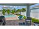 Inviting backyard with a pristine pool, lush landscaping, and a cozy seating area for outdoor enjoyment at 314 Blackrock Ln, Apollo Beach, FL 33572