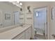 Bright bathroom featuring a stylish vanity, and a separate area with a bathtub and a shower at 314 Blackrock Ln, Apollo Beach, FL 33572